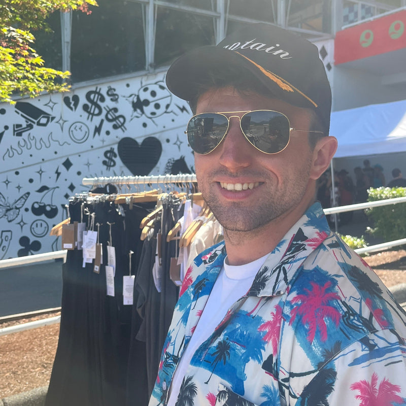 Man wearing the Captain  Hat  & sunglasses with a Hawaiian shirt  @ the Country Club Festival
