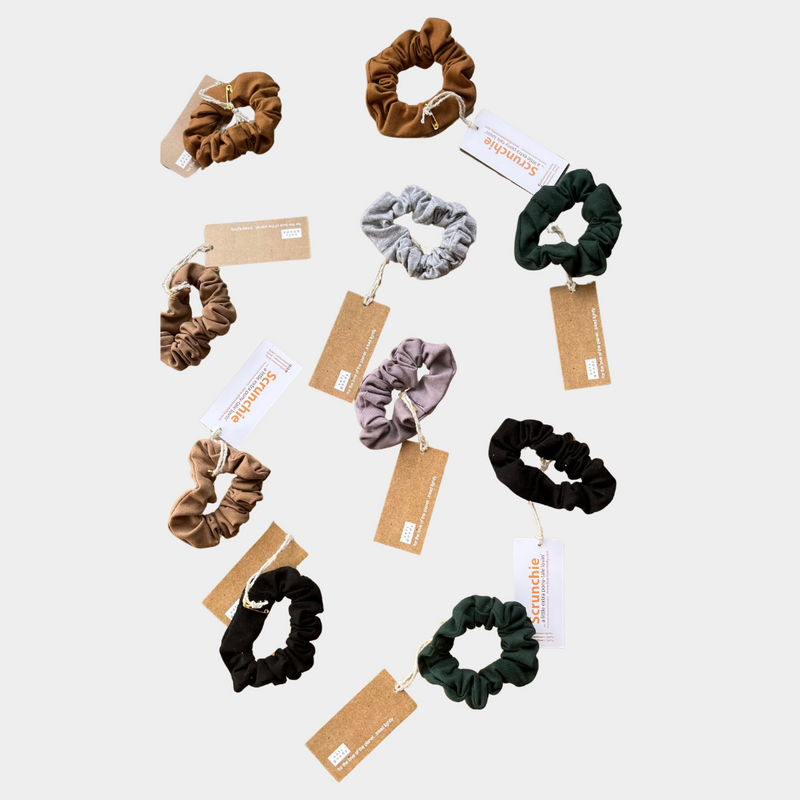 Scrunchies with a tag on a white background